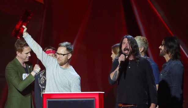 Man gets NAKED live on TV at Foo Fighters Glastonbury set